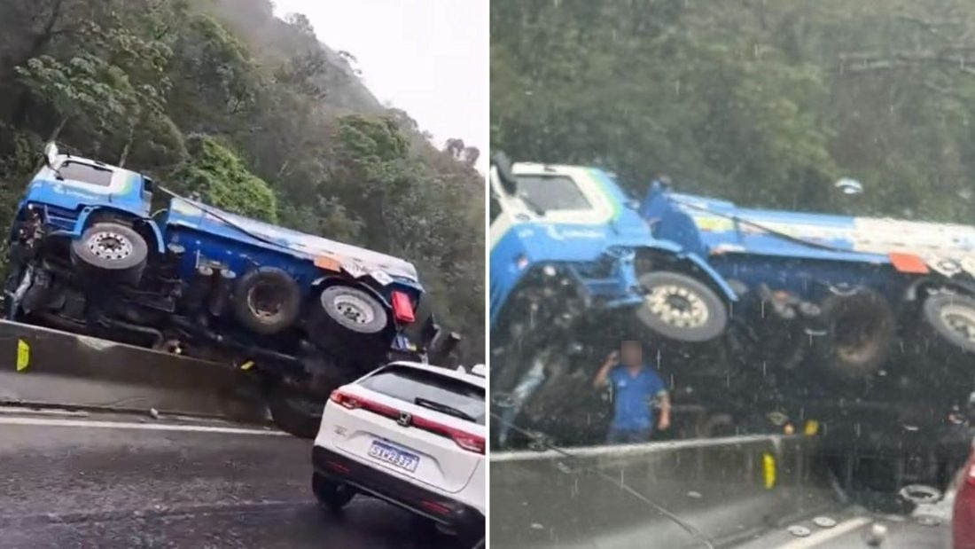 Caminhão atravessado em mureta interdita faixas e trava trânsito na BR-101, no Morro dos Cavalos