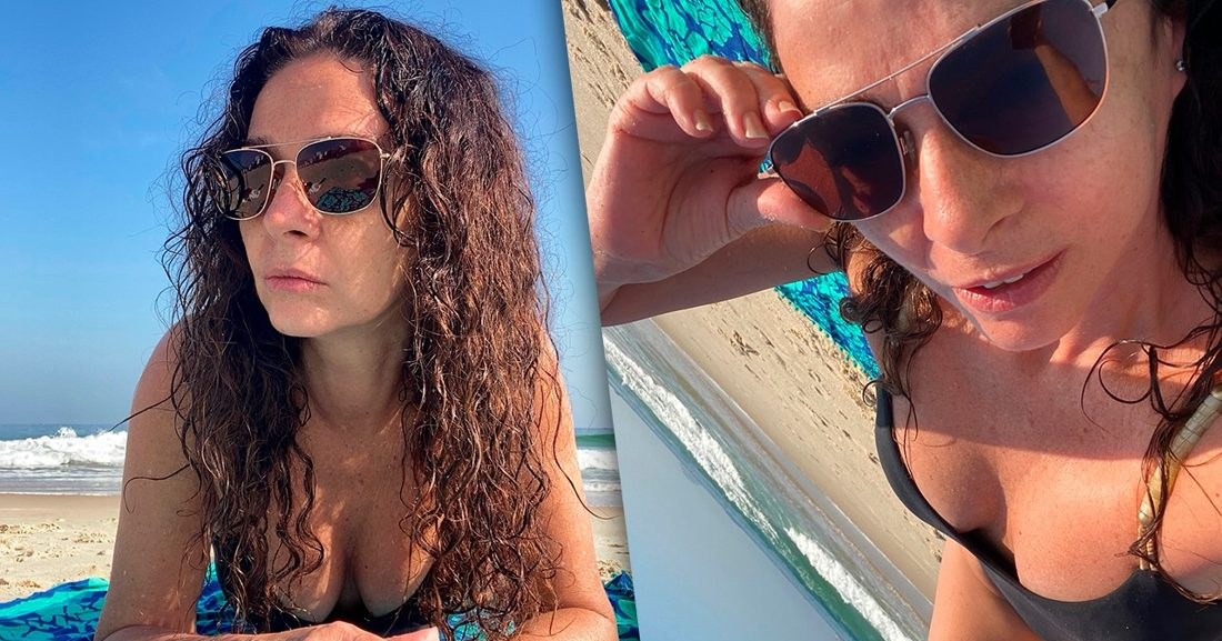 Claudia Ohana brilha em maiô preto sob sol de domingo na praia carioca